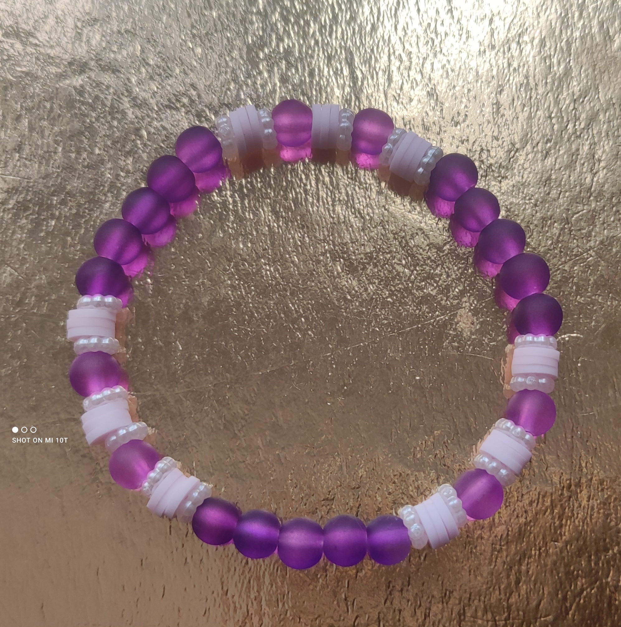 Bracelet en perles de verre violet avec perles d'espacement rose